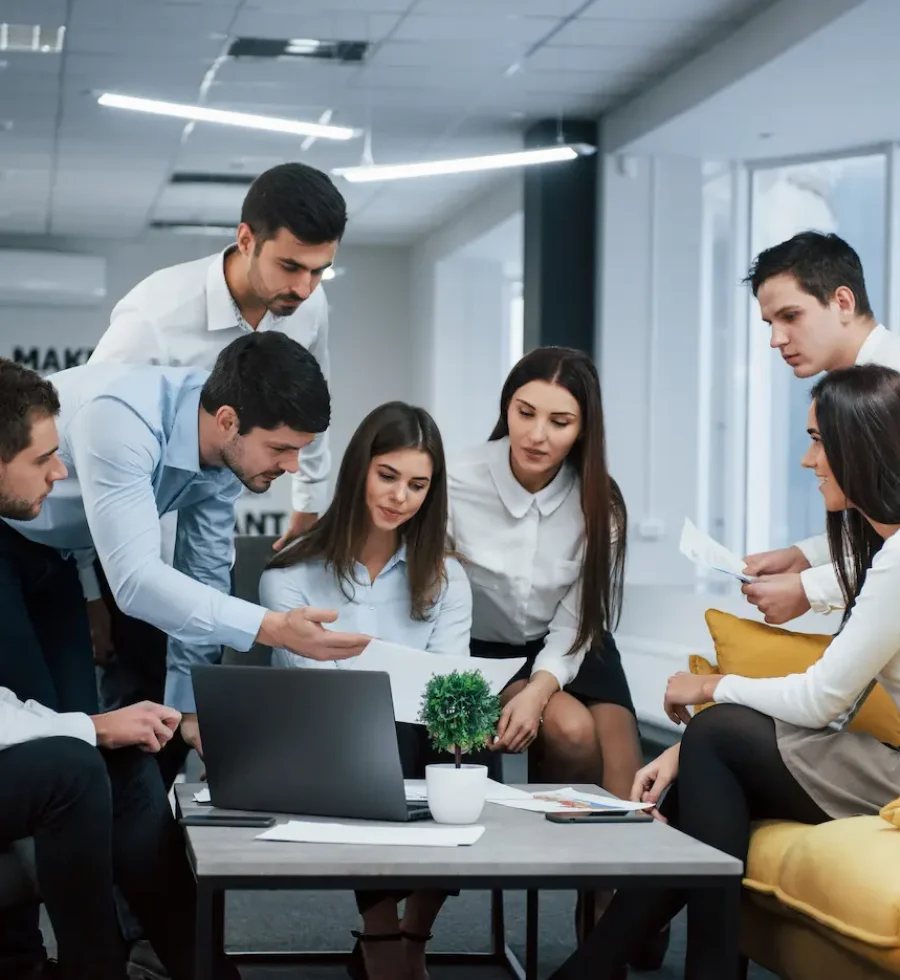 guy-shows-document-girl-group-young-freelancers-office-have-conversation-working